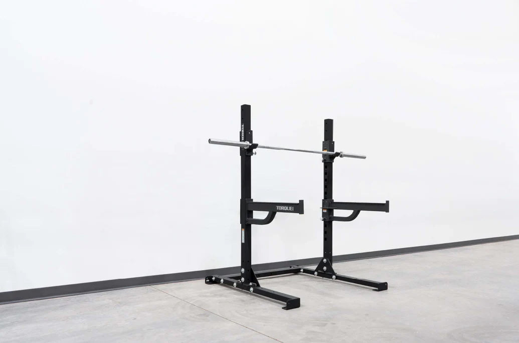 short squat rack with barbell and spotter arms